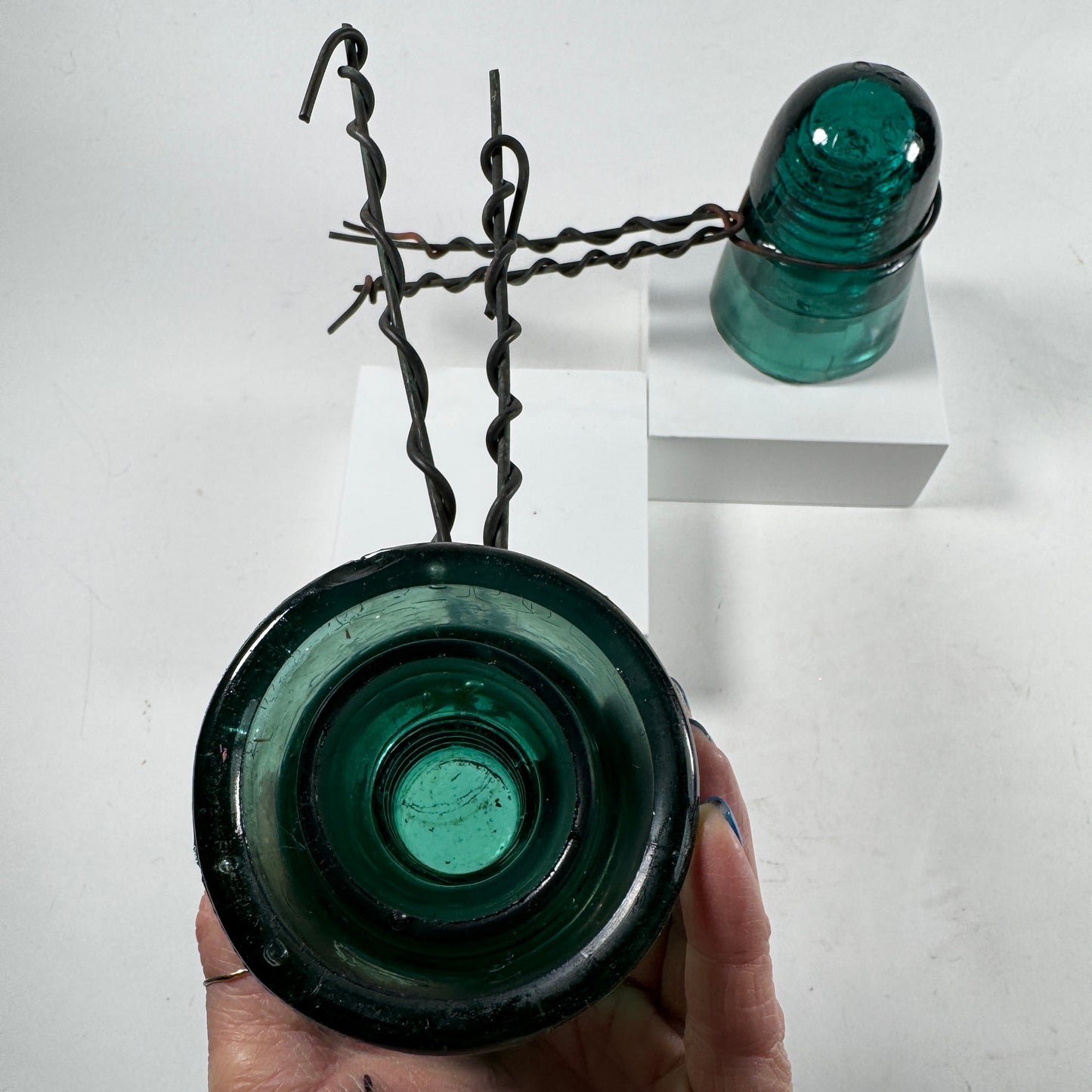 Two Blue Green Insulators with Old Wire